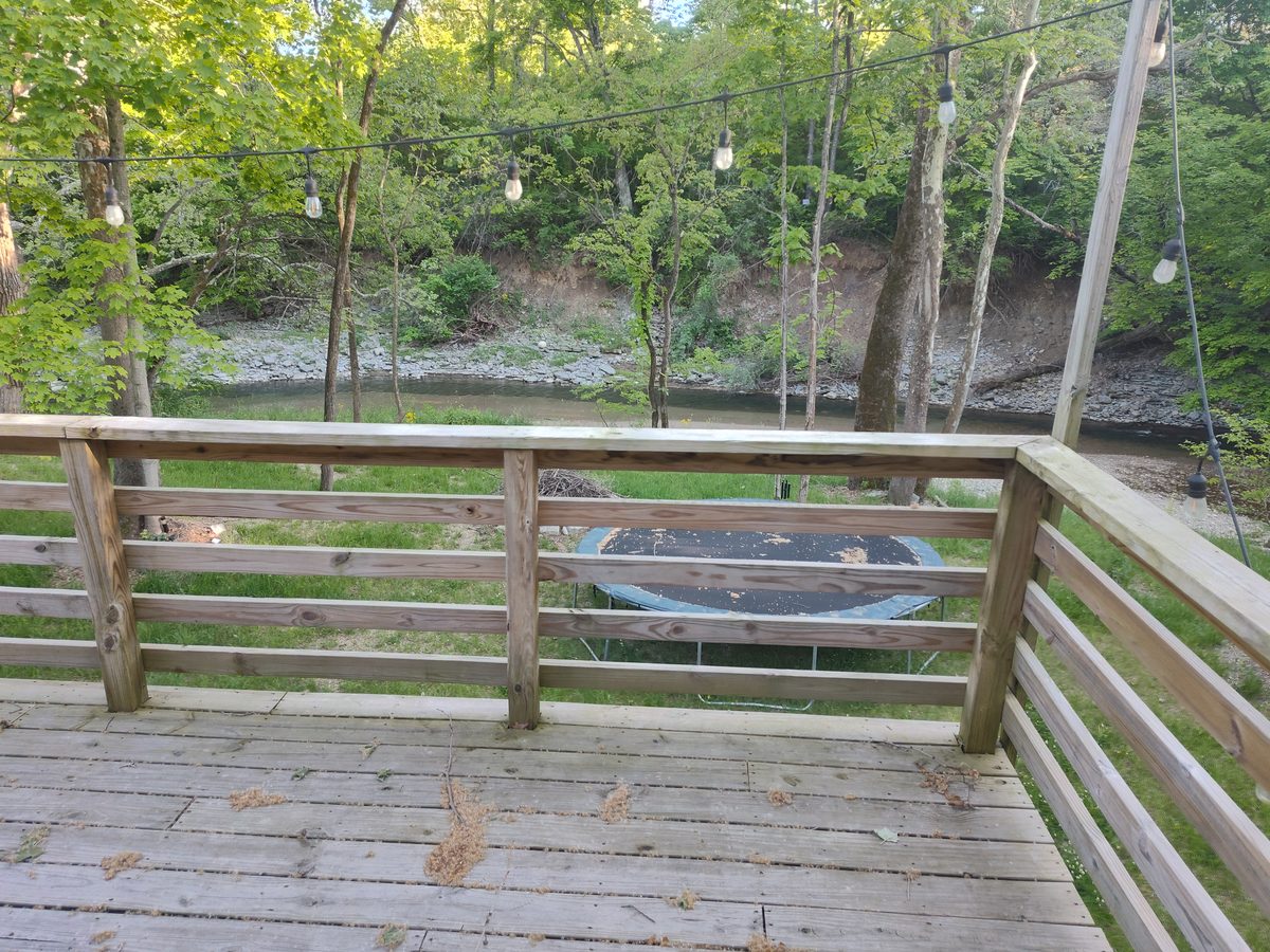 Back deck overlooking the creek and wooded grounds at the Bear Creek recovery home in Miamisburg, Ohio